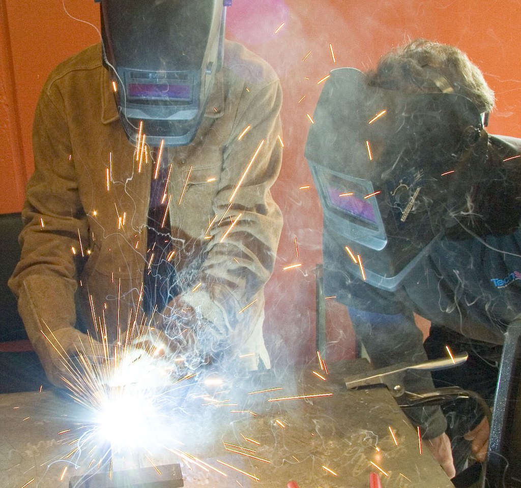 Welders working with sparks